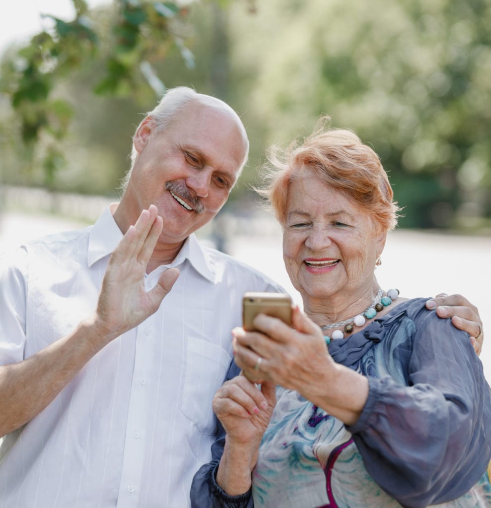 older white couple on phone - Medicare advantage benefits